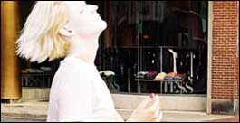 A performance artist puts on his makeup